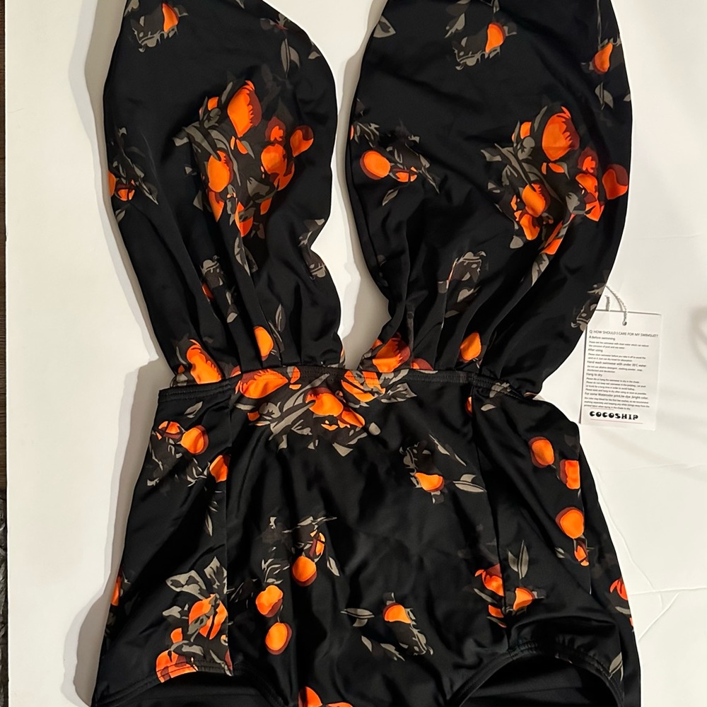 Look fabulous in this fun Black One Piece Swim Suit.